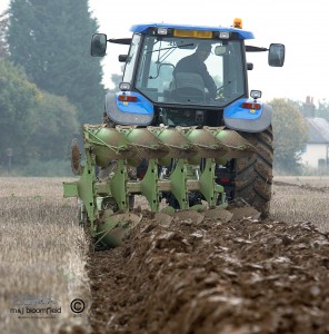 Tractor ploughing field