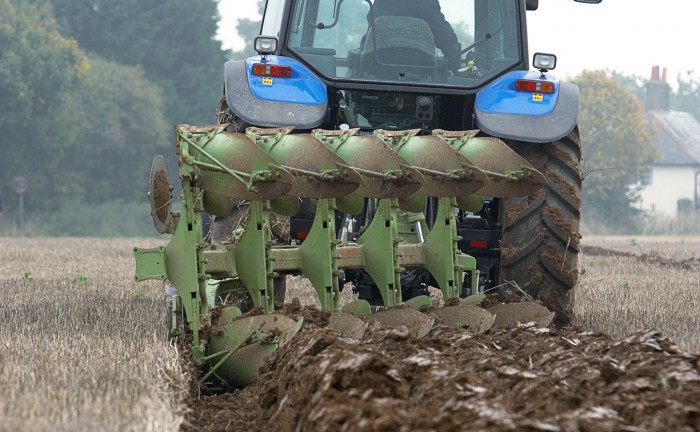 Tractor ploughing field