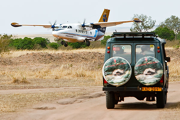 Safari truck and bush plane in Kenya's Masai Mara